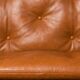 Paire de fauteuils lounge « safari » en cuir cognac et hêtre noir — c. 1970