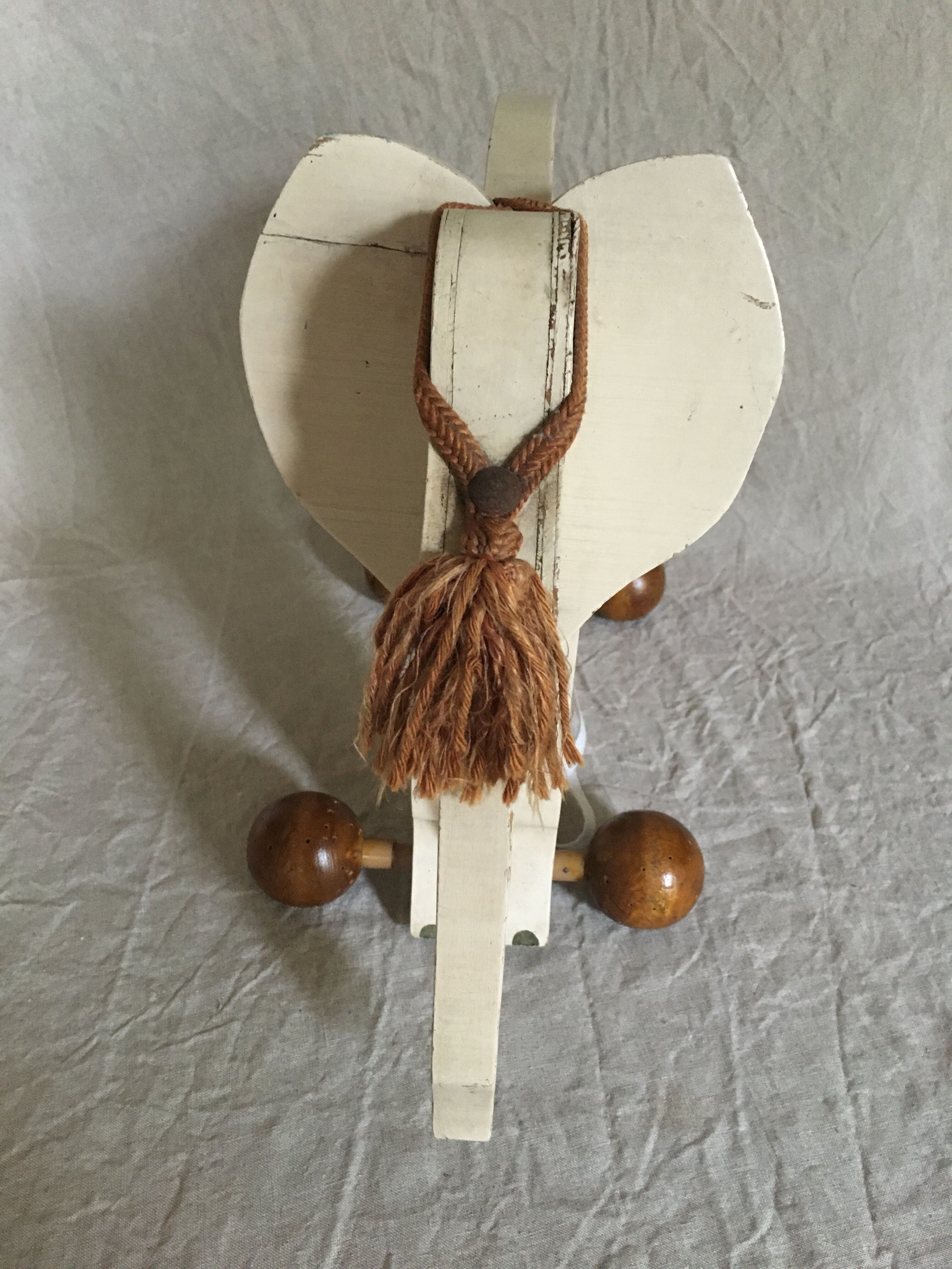 Wooden elephant on wheels