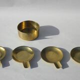 4 brass ashtrays in their 1970 case