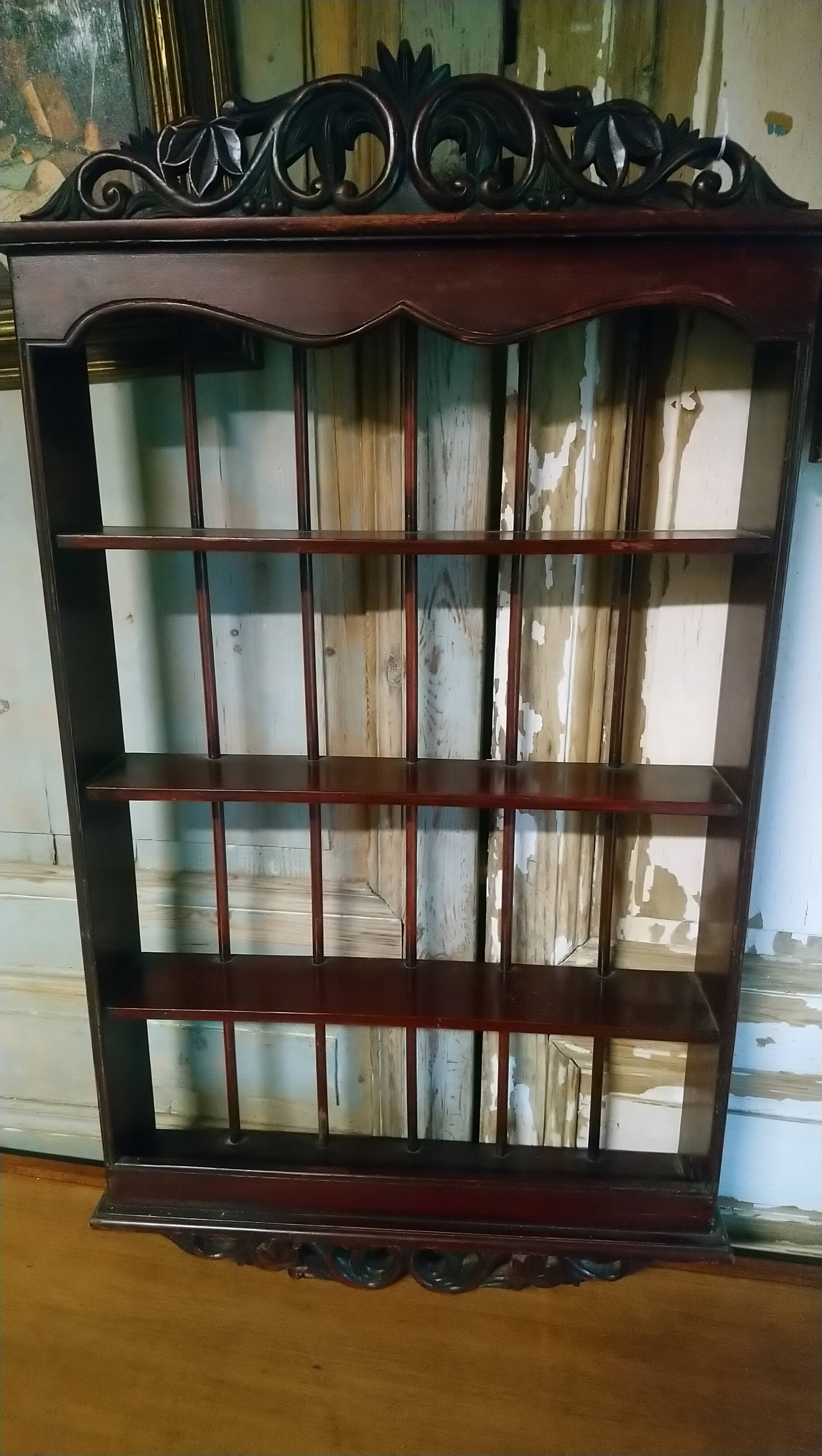 Carved wooden wall shelf for collection or other.