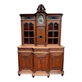 Antique rococo sideboard with integrated clock.