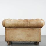 Chesterfield armchair made of cowhide leather in a light cognac colour
