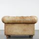 Chesterfield armchair made of cowhide leather in a light cognac colour