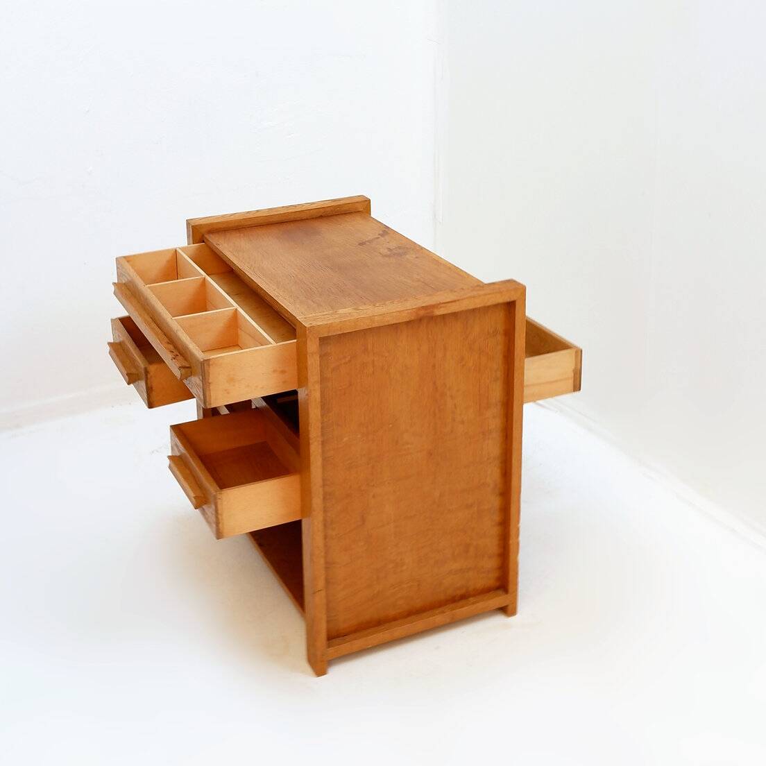 1960s wooden sewing cabinet with double-sided drawers