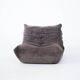 Ensemble de chaise et pouf Togo en velours côtelé marron.