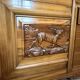 Solid wood sideboard with marble top and carved panels.
