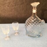 Worked glass carafe and flower-shaped stopper
