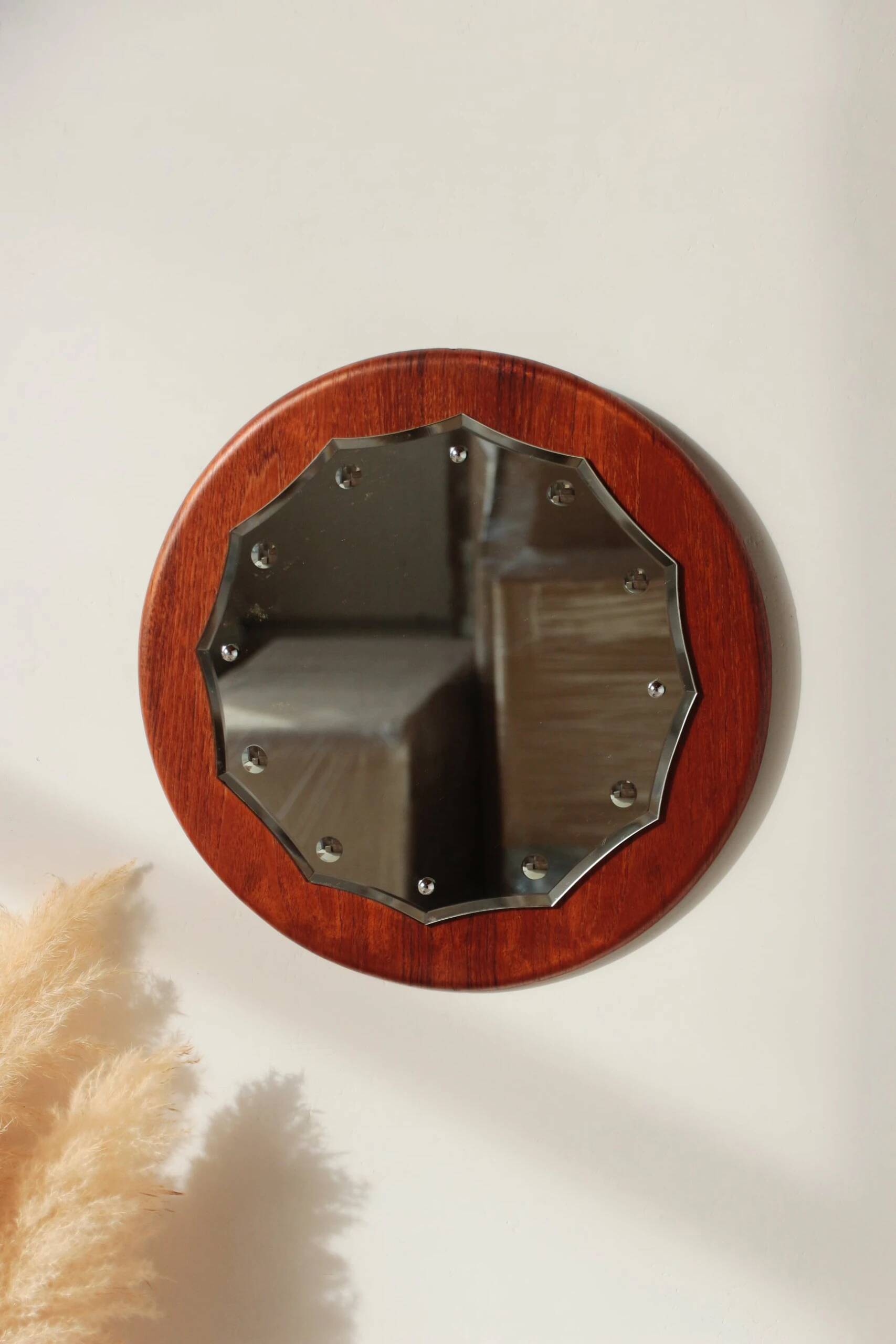 Vintage round teak mirror from the 1960s.