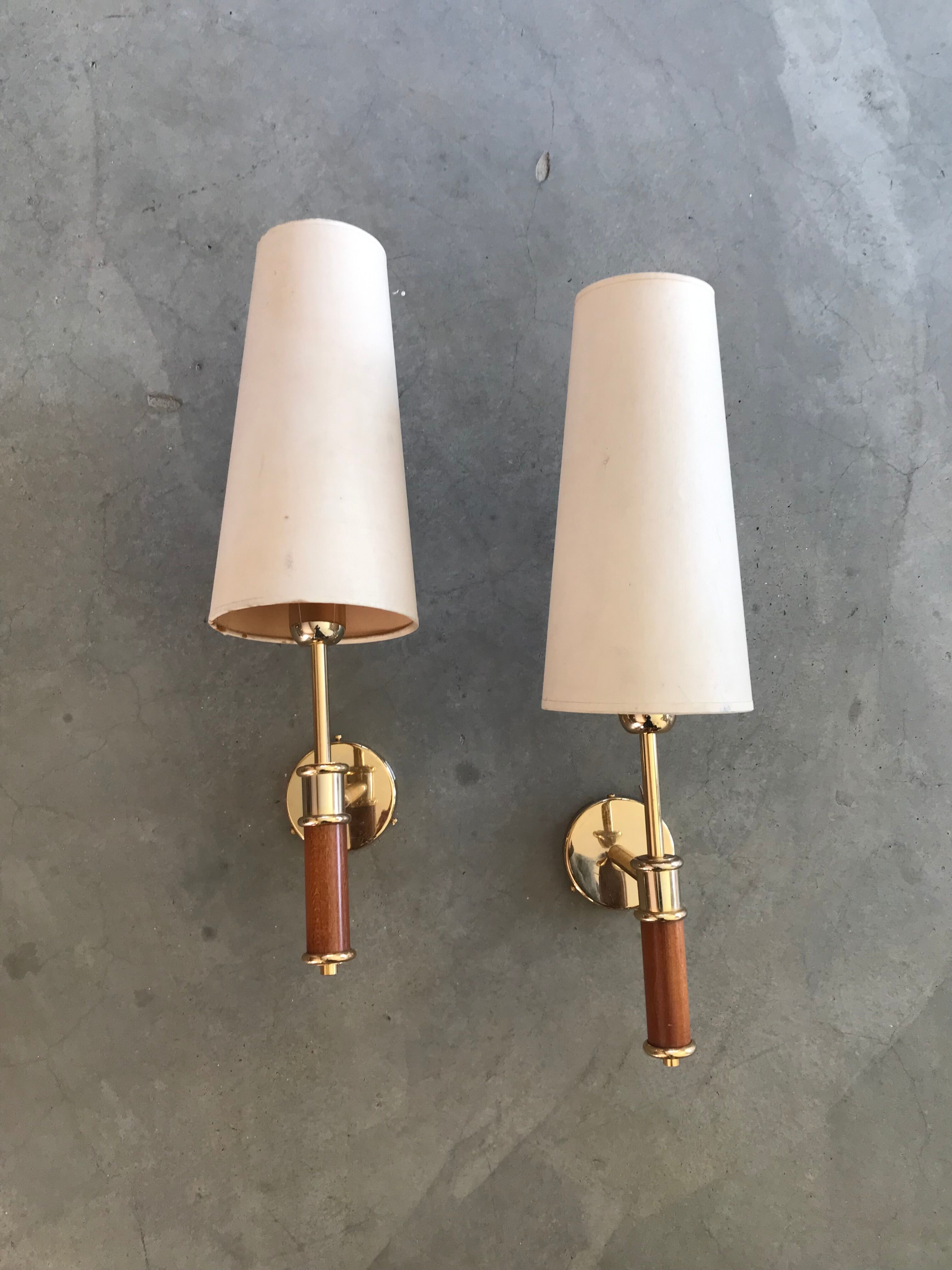Pair of modernist sconces in wood and gilded metal.