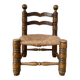 Low fireplace chair in the style of Charles Dudouyt