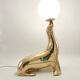Vintage brass sea lion lamp