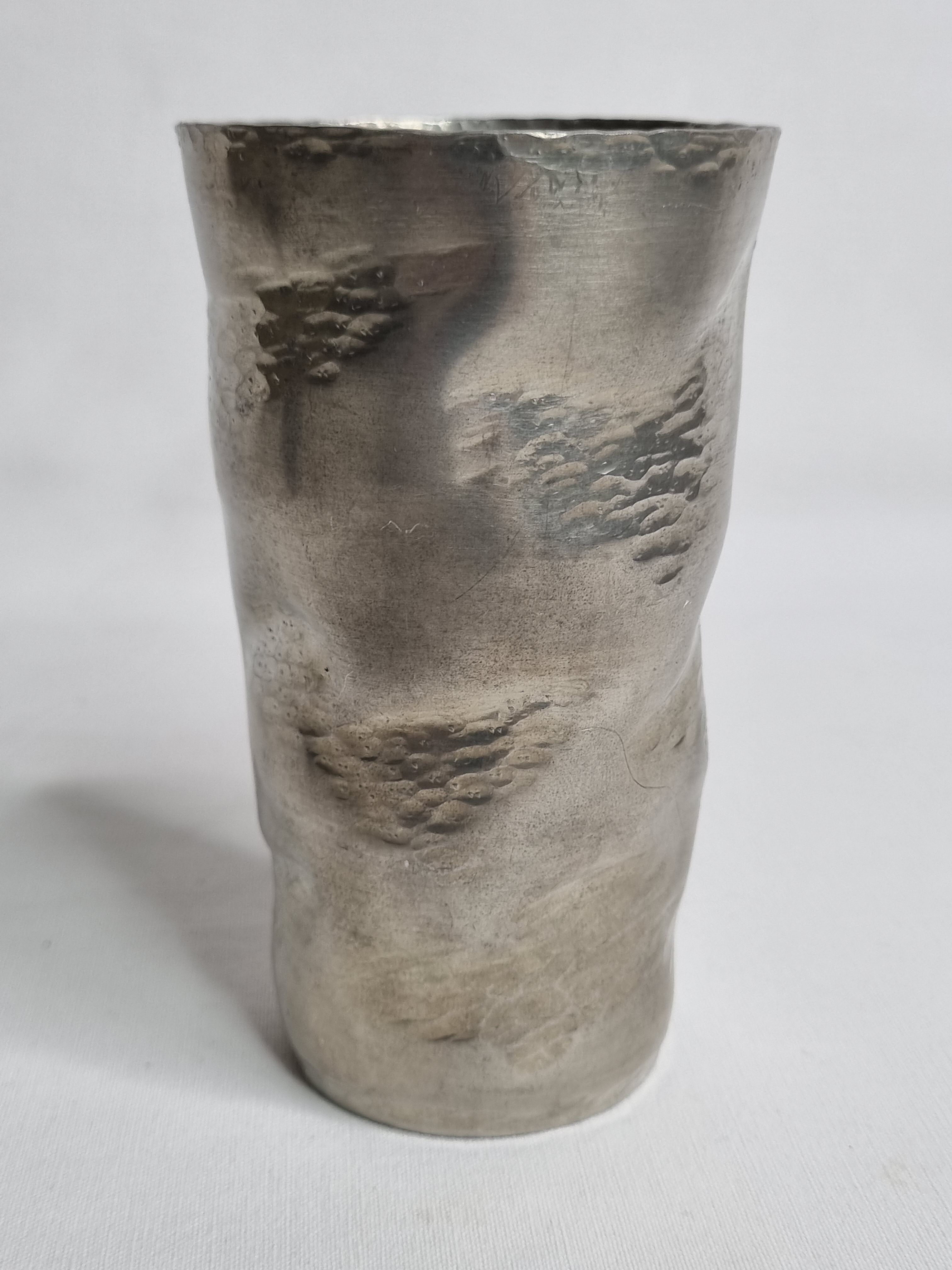 Hammered tin cup, signed