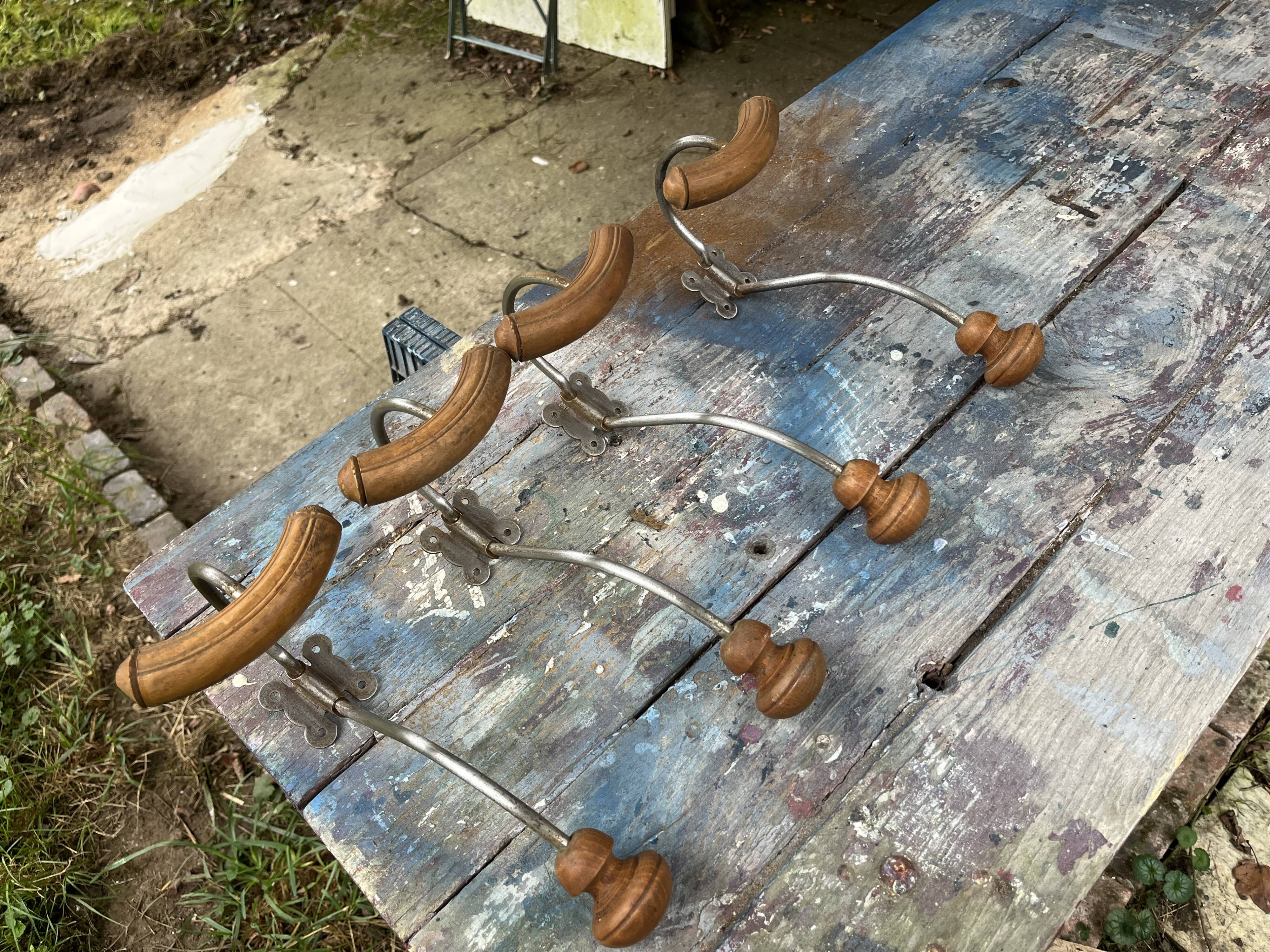 Set of 4 wooden and iron coat hooks from the 60s