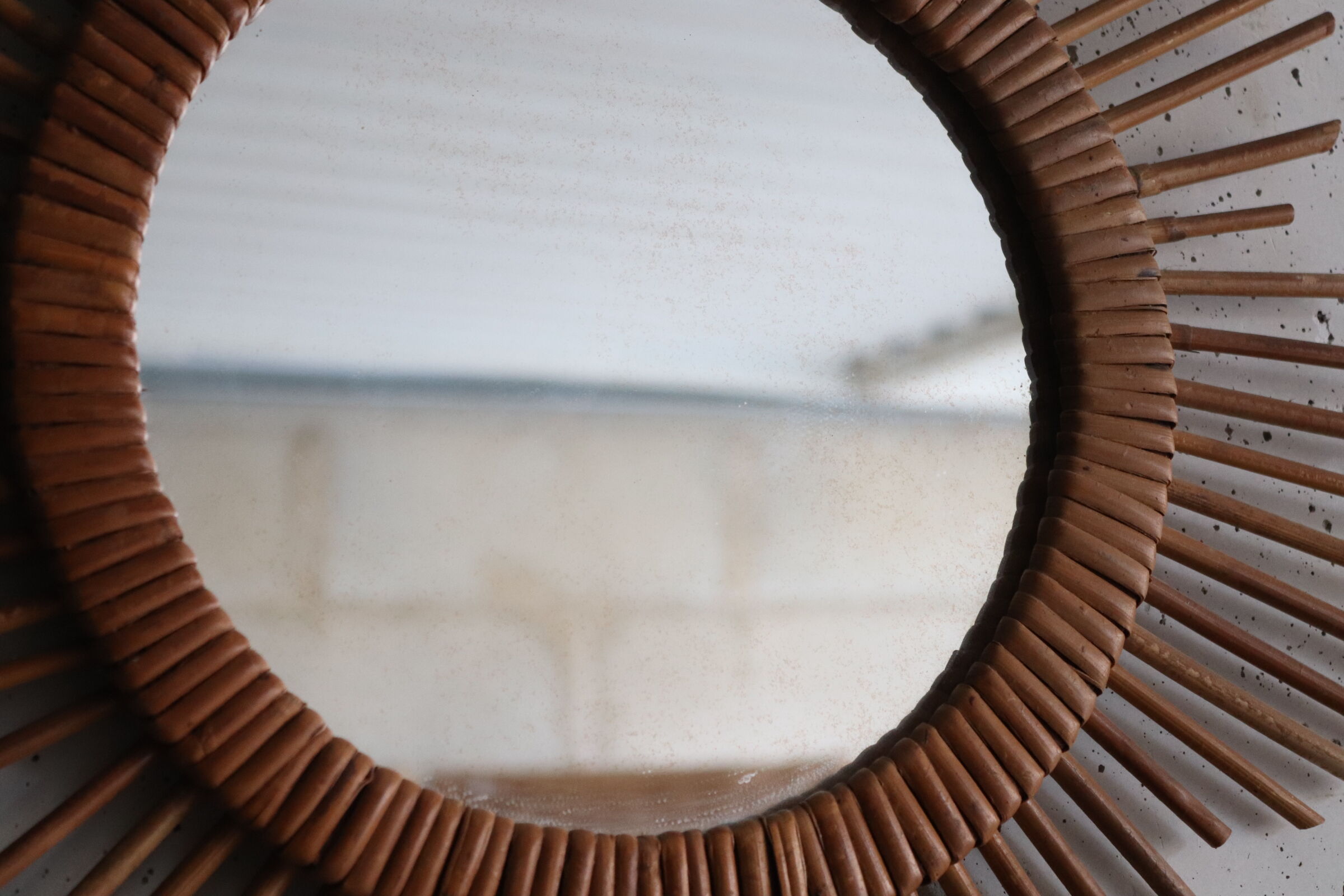 Vintage rattan sun mirror