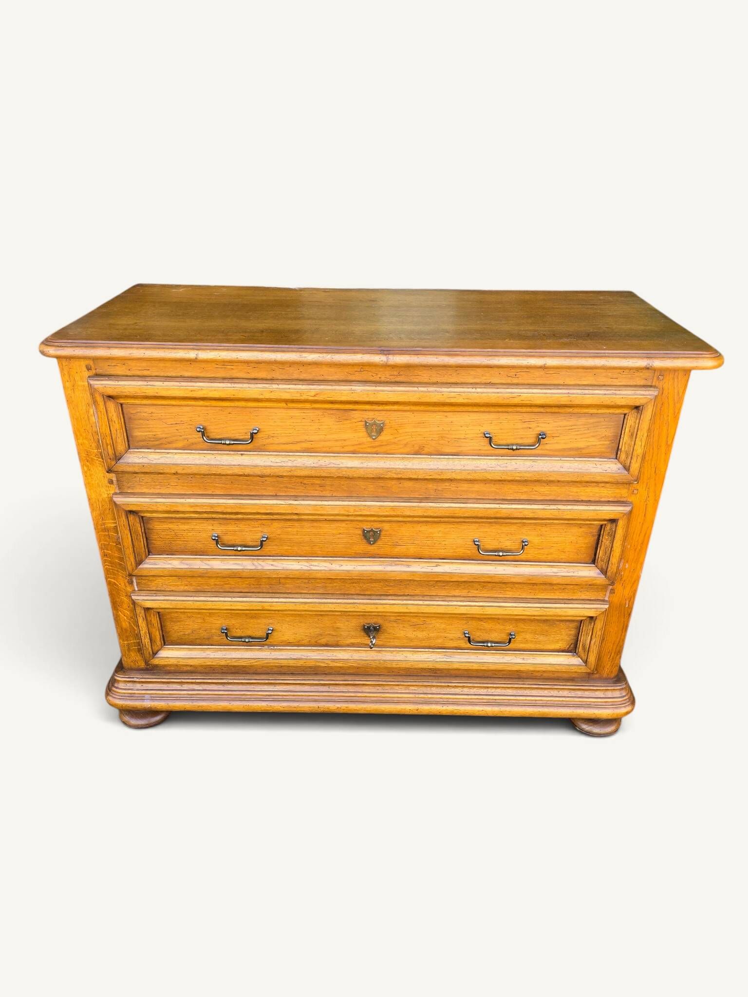 Antique oak chest of drawers with three drawers in Louis XIII style.