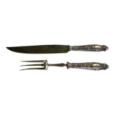 Leg cutlery set. Silver handles.