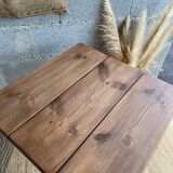 Bistro table with central cast iron leg and rustic top