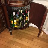 A mahogany buffet varnished with marble and bronze