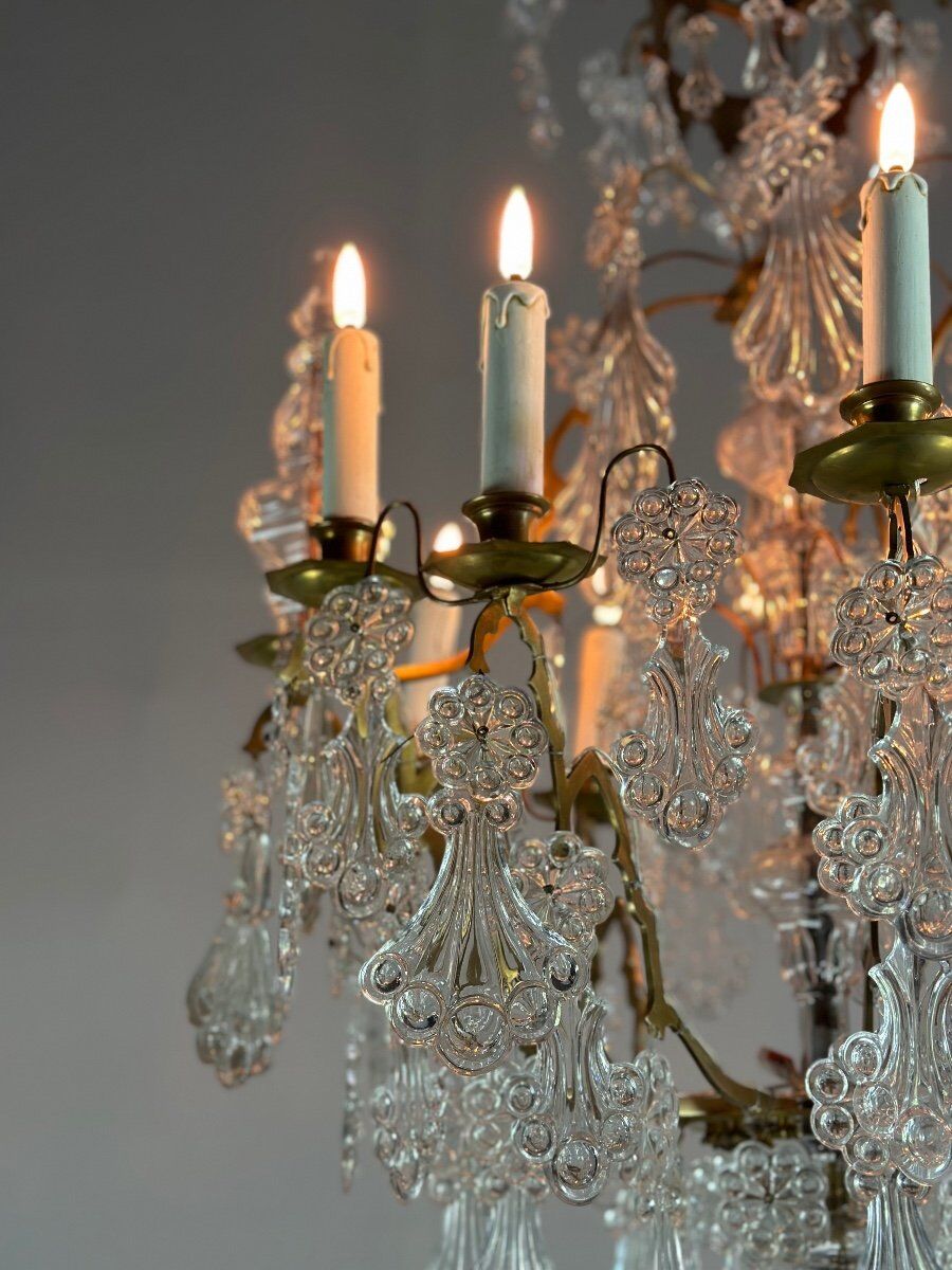 Bronze cage chandelier adorned with molded glass pendants in the shape of peacock feathers, circa 1800