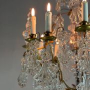 Bronze cage chandelier adorned with molded glass pendants in the shape of peacock feathers, circa 1800