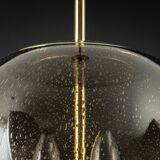 Large Limburg pendant light in brass with smoked glass ball, Germany, 1970s.