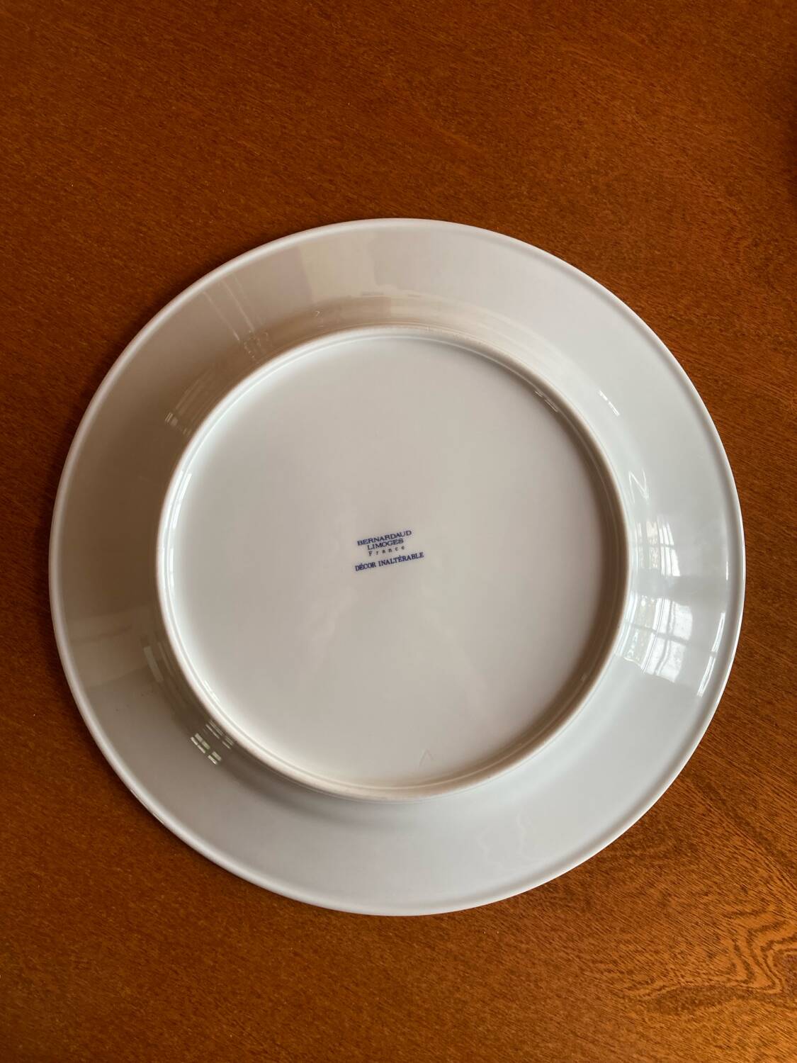 Round Limoges Bernardaud porcelain dish with floral frieze and sticks