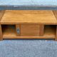 Solid wood coffee table with sliding door, stained pine, 120x60cm.