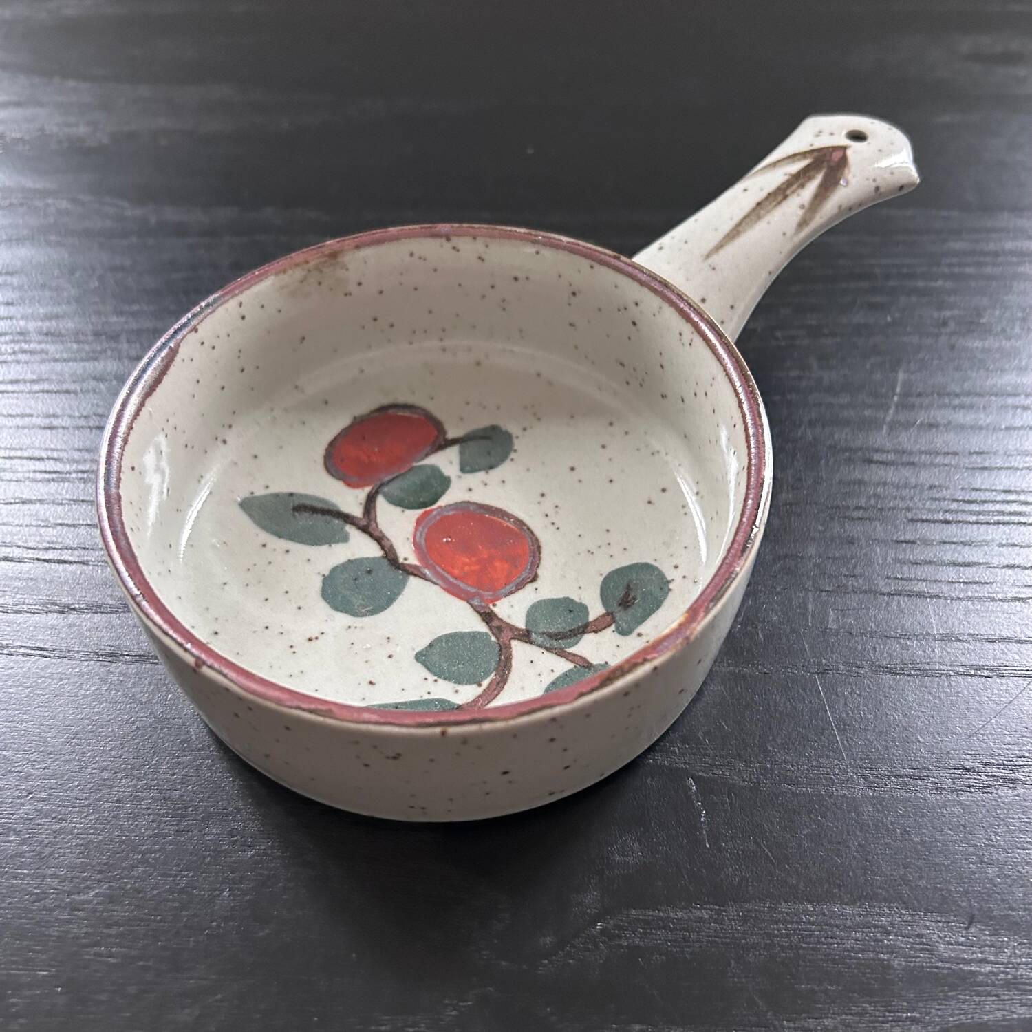 Frying pan with red fruit decoration