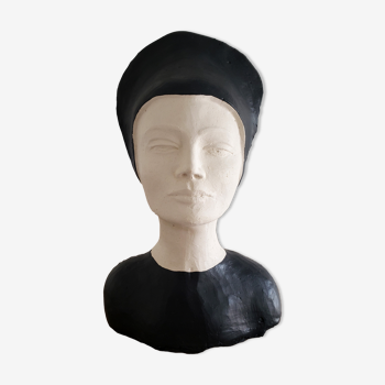 Bust of a woman in anthracite and white plaster