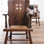 Pair of brutalist oak lounge chairs with rush seats, circa 1935