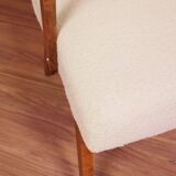 Vintage beige bouclé armchair with walnut wood from the 1950s.