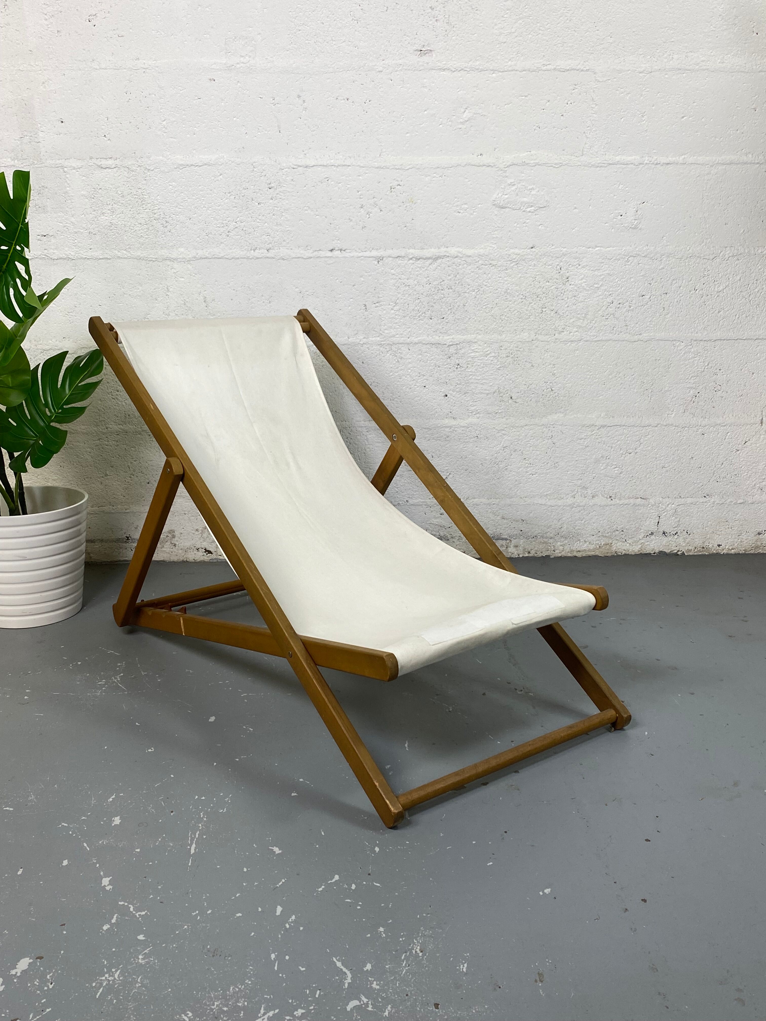 White fabric deckchair with wooden structure