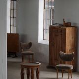 Modern Danish mid-century table, made of oak with spiral turned legs and a glass top, 1950s.