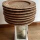 Set of round woven rattan and canework coasters