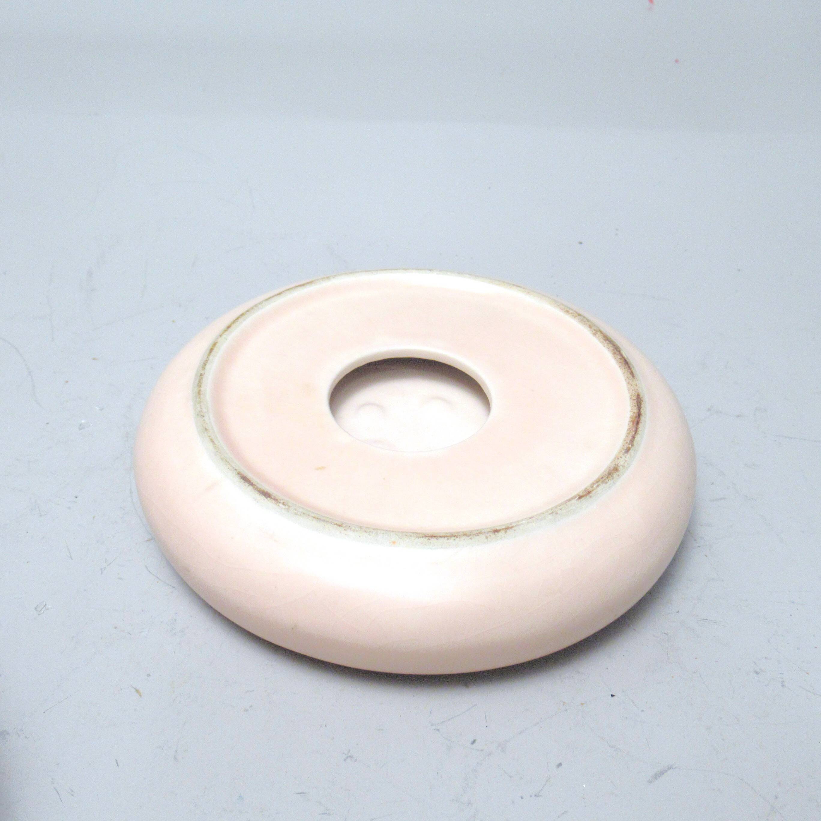 Pale pink ceramic ashtray from the 1980s.