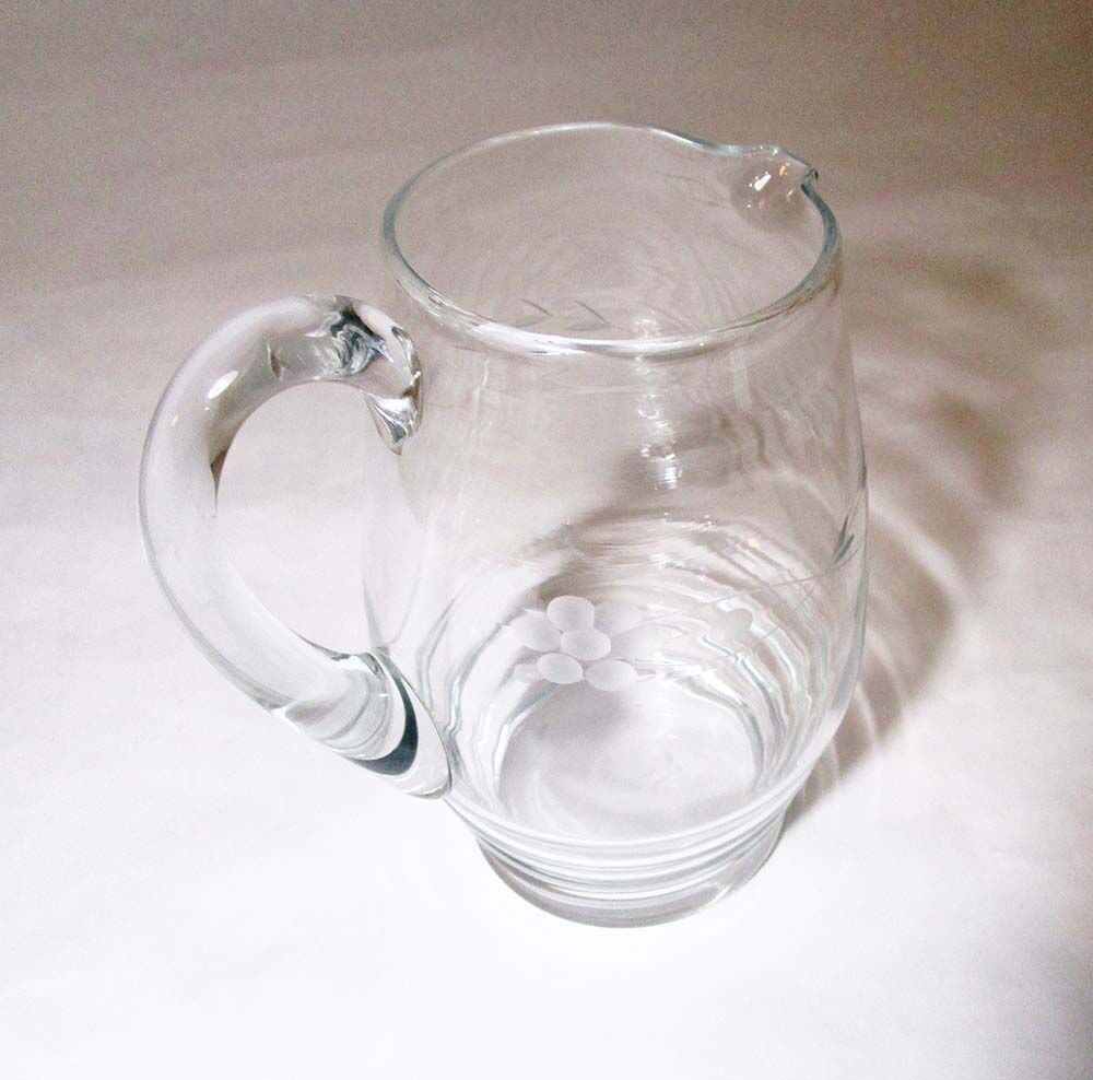 Vintage pitcher in chiseled glass