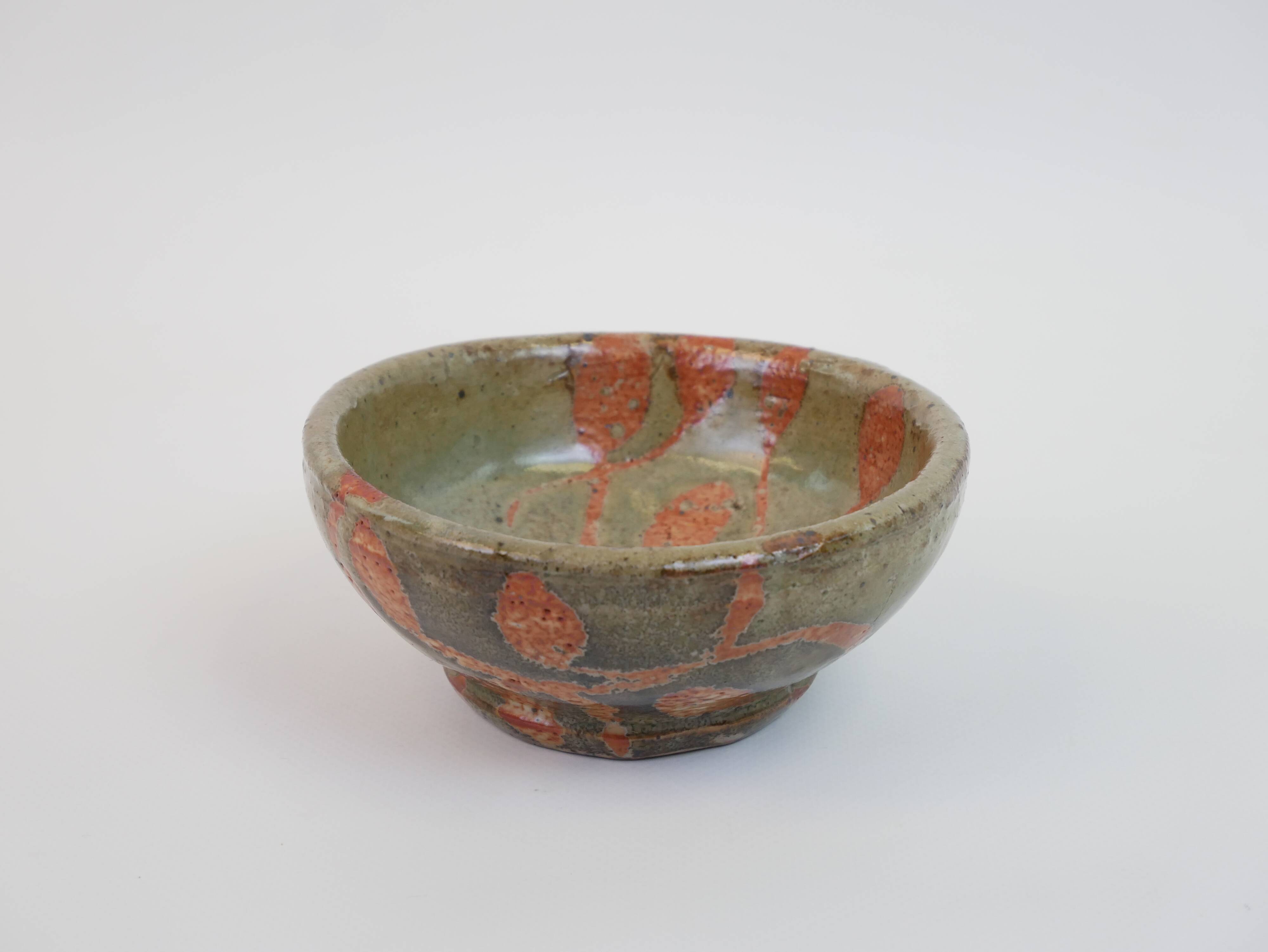 Small bowl in water green glazed ceramic with coral pink pattern