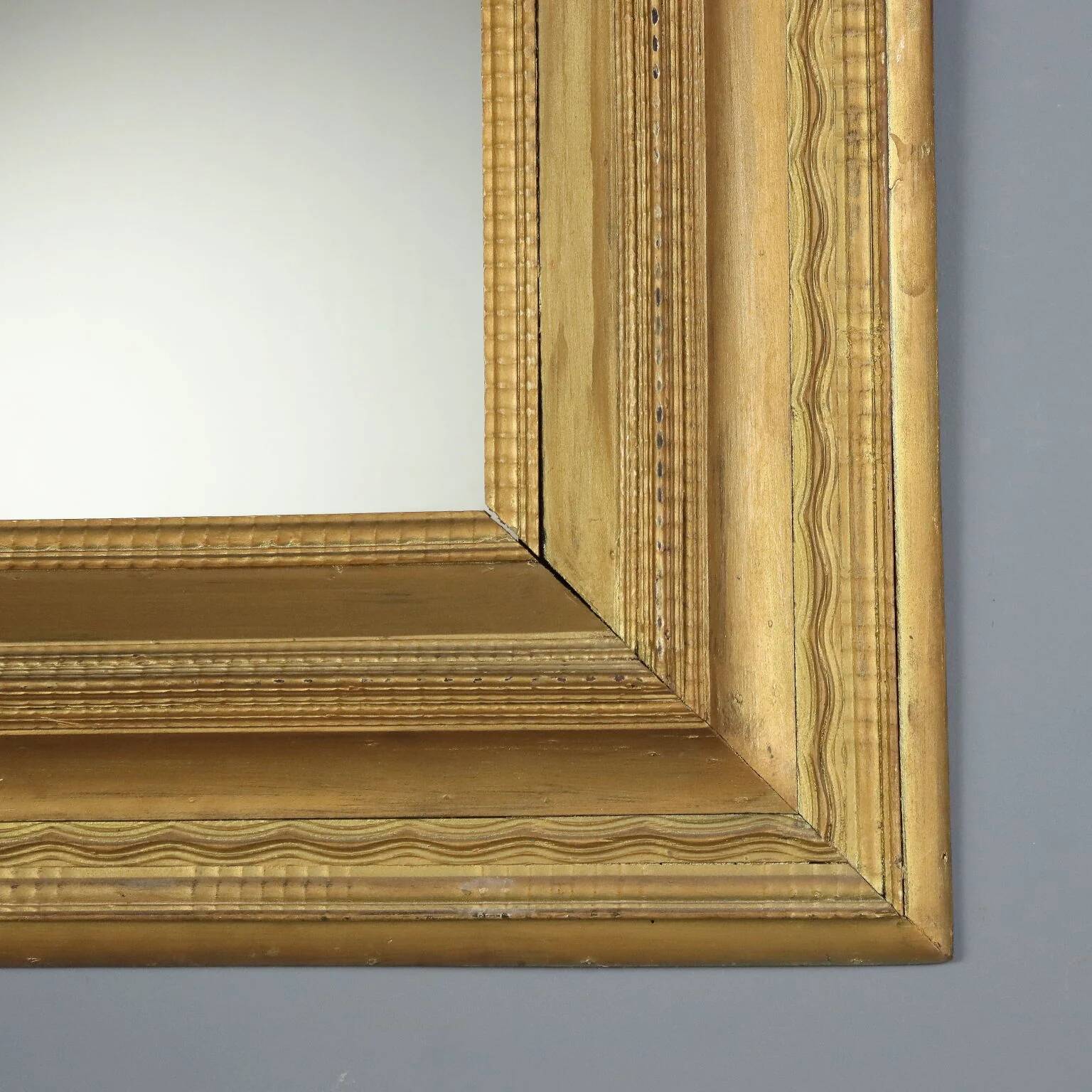 Antique gilded wooden mirror with guilloché frame, Italy, 19th century.