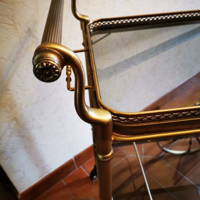 Golden metal serving trolley