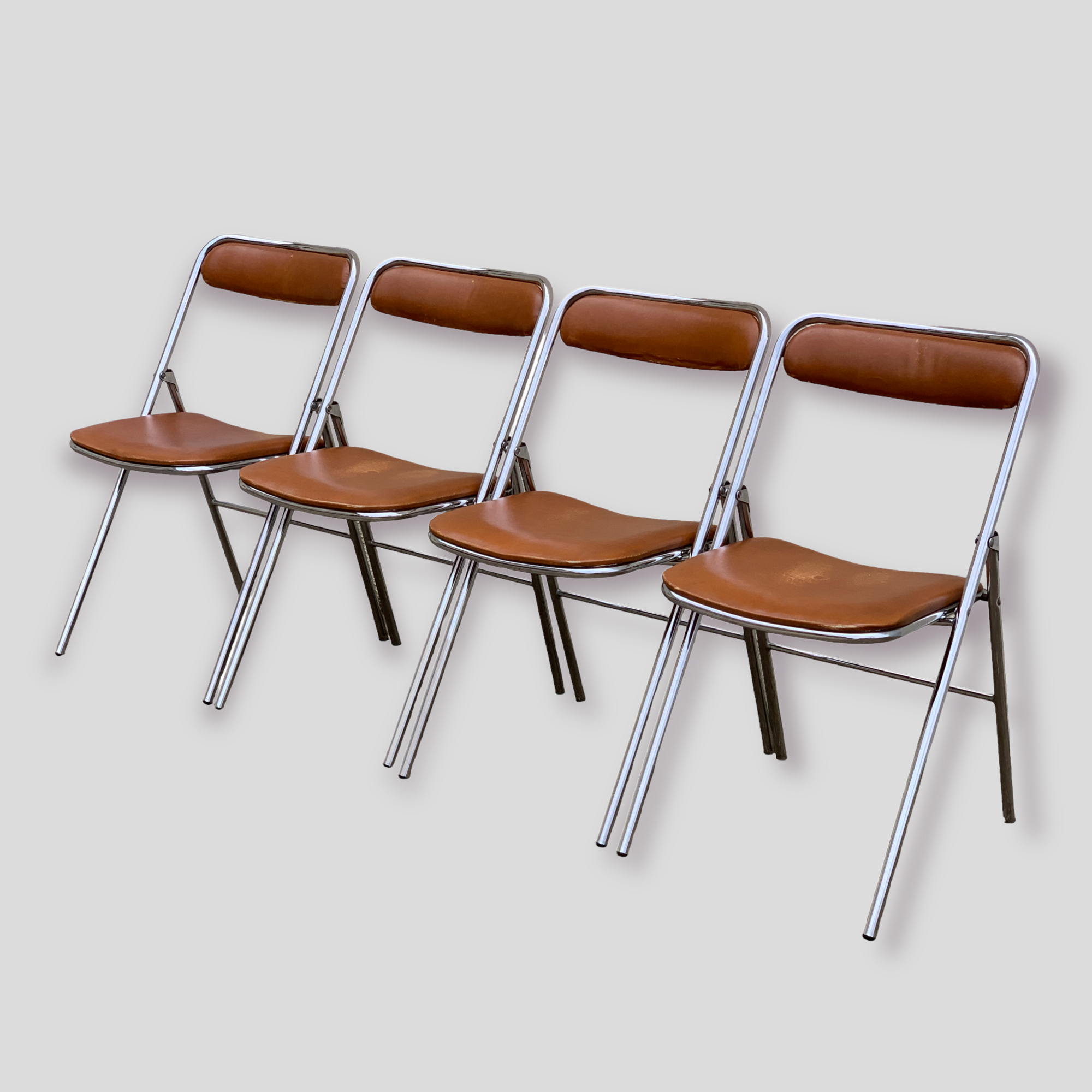 4 folding chairs chromed metal and Skaï fawn 1970