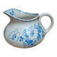 Small antique ironstone jug L.m Creil and Montereau with blue floral decoration.
