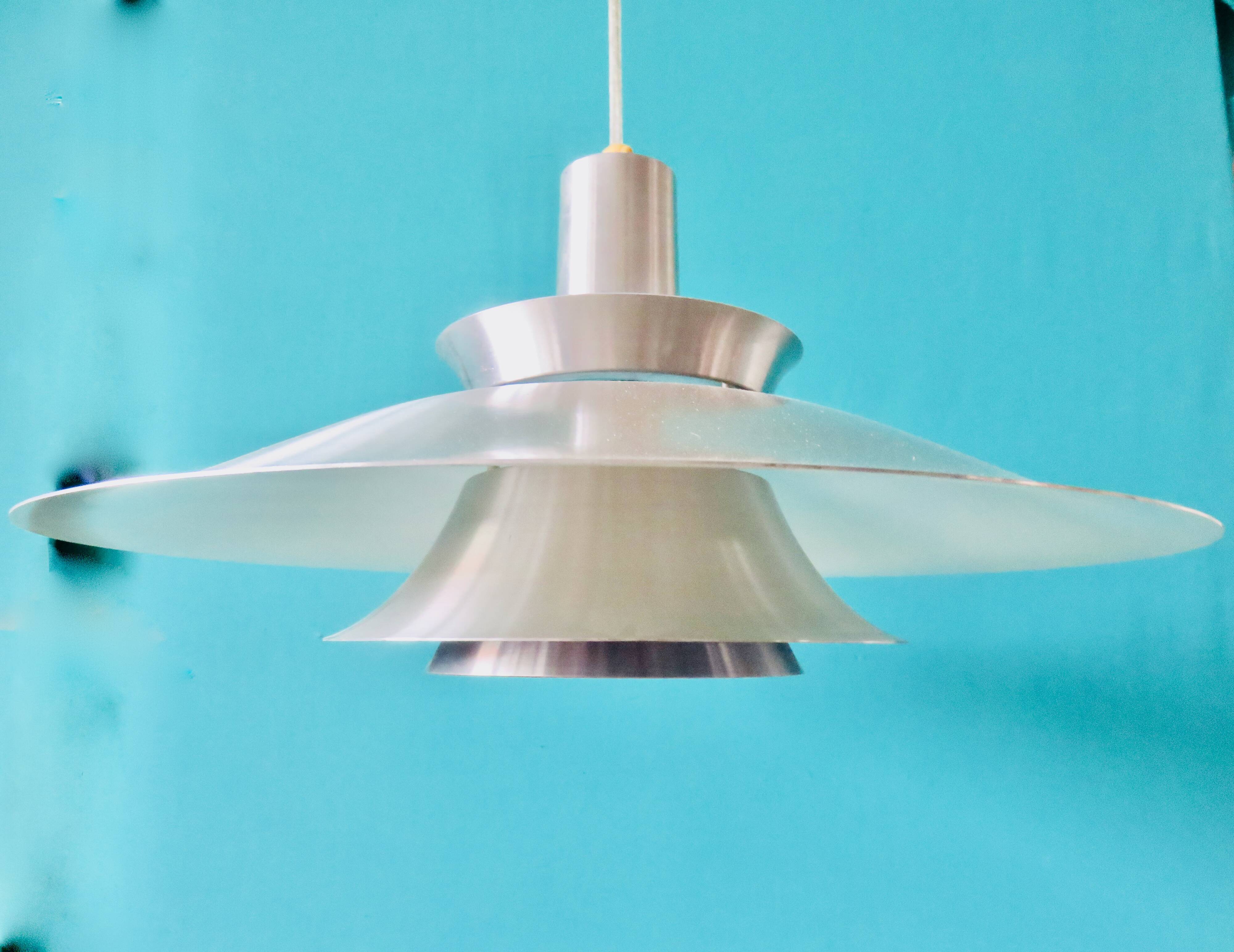 Suspension in brushed aluminum, interior in 3 colors. Denmark 1970