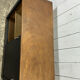 Small vintage black buffet with sliding doors.