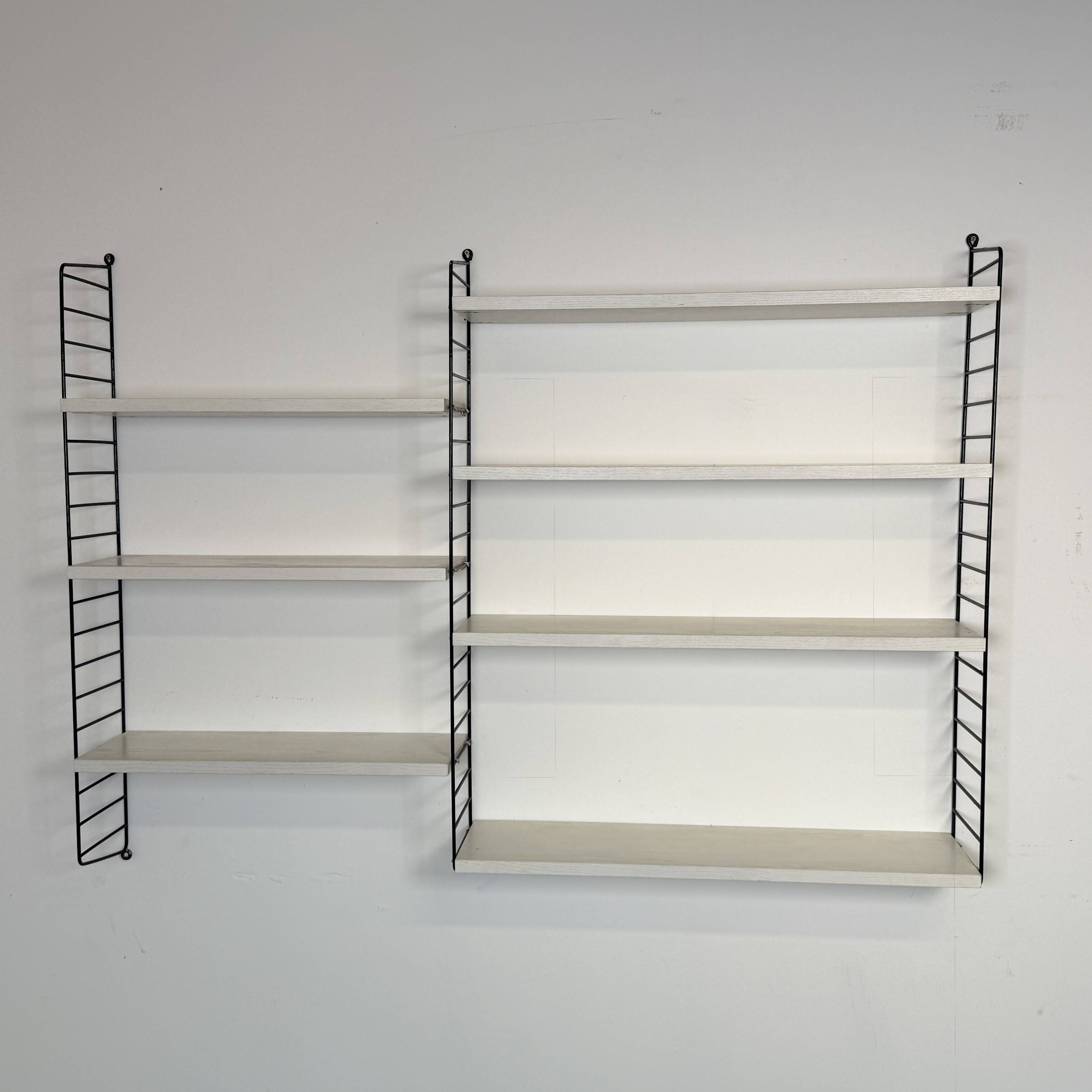 Vintage Nisse Strinning wall rack with 7 white shelves