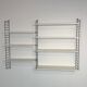 Vintage Nisse Strinning wall rack with 7 white shelves