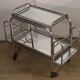 Vintage 1970s rolling dessert trolley in chrome metal and mirrored glass.