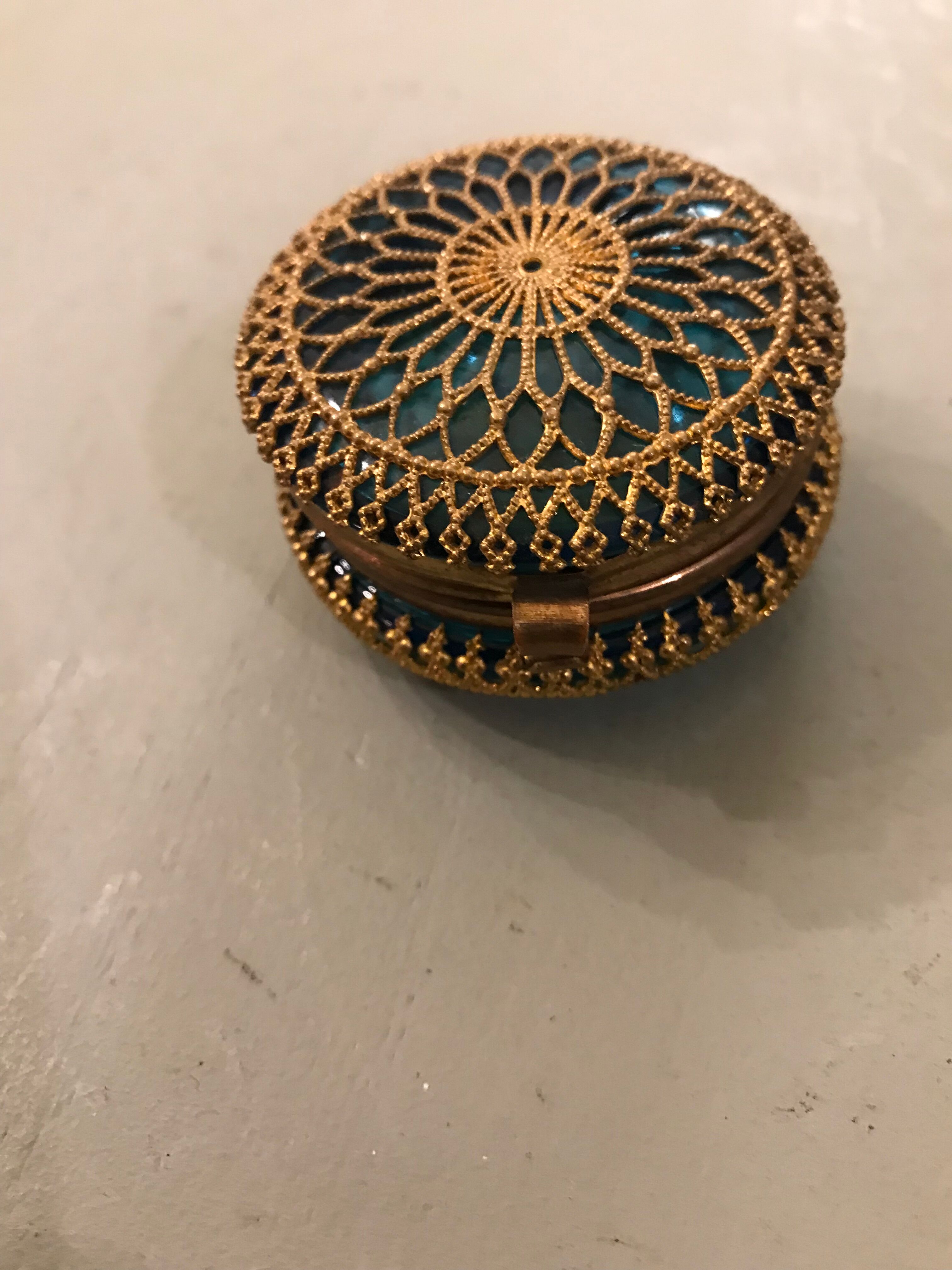 Old pill box made of golden thread