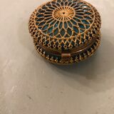 Old pill box made of golden thread