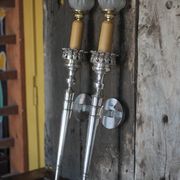 Large pair of silver-plated wall lights with flame globes, torches.