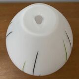White opaline tulip with dark green and gray streaks. Oblong shape.